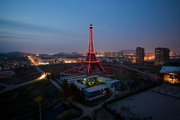 The fake Eiffel Tower lights up the night in Tianducheng